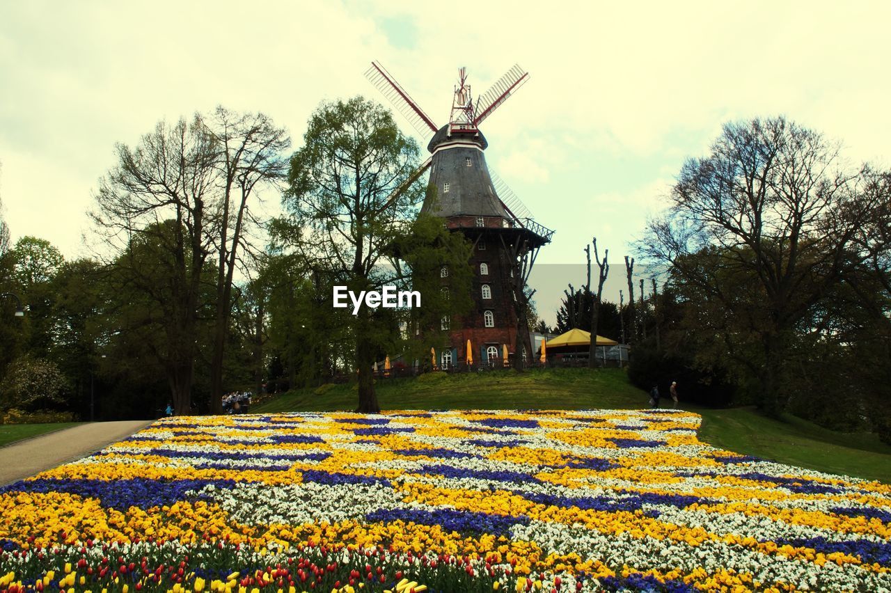 Traditional windmill against sky