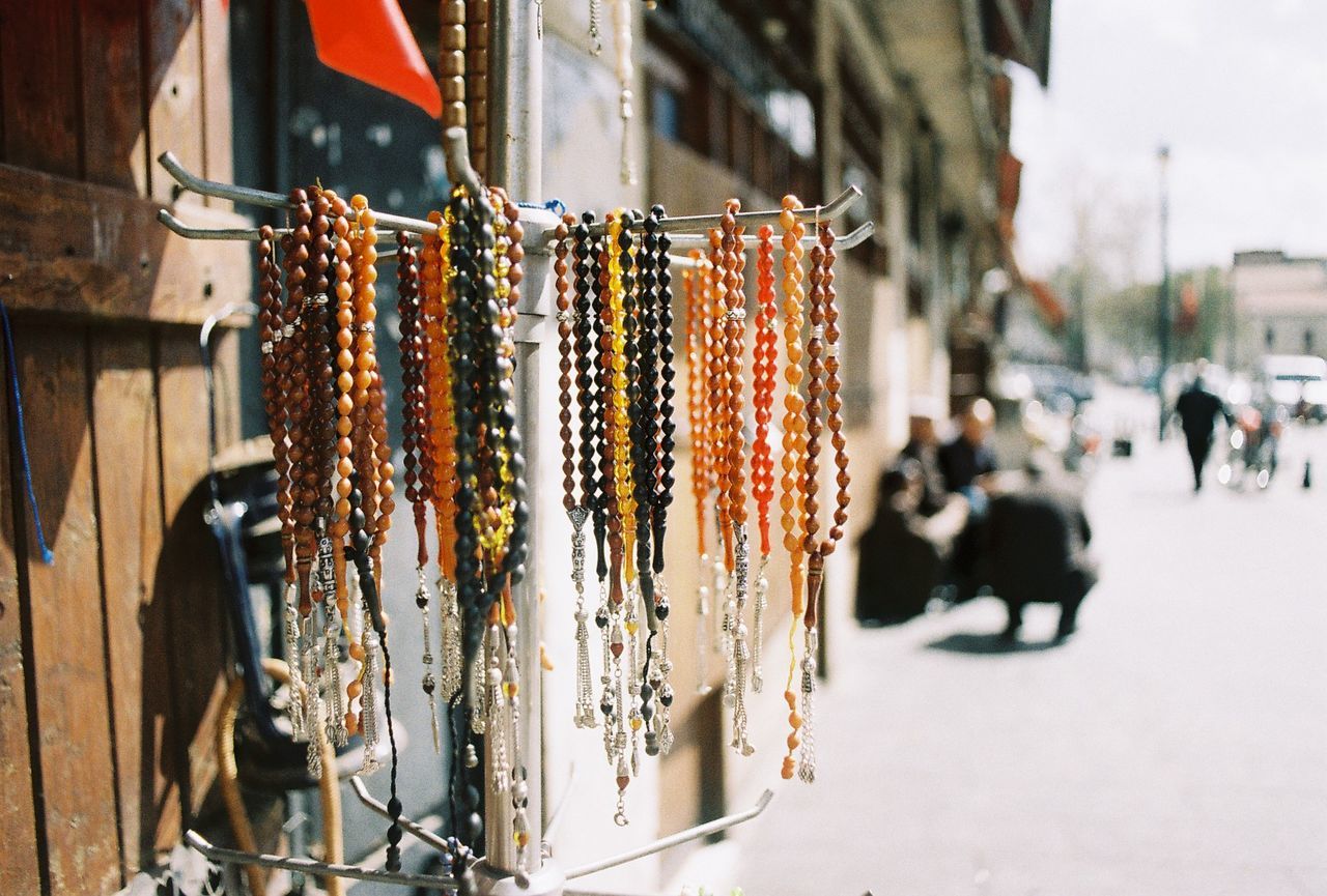 Close-up of bead necklace hanging at market stall