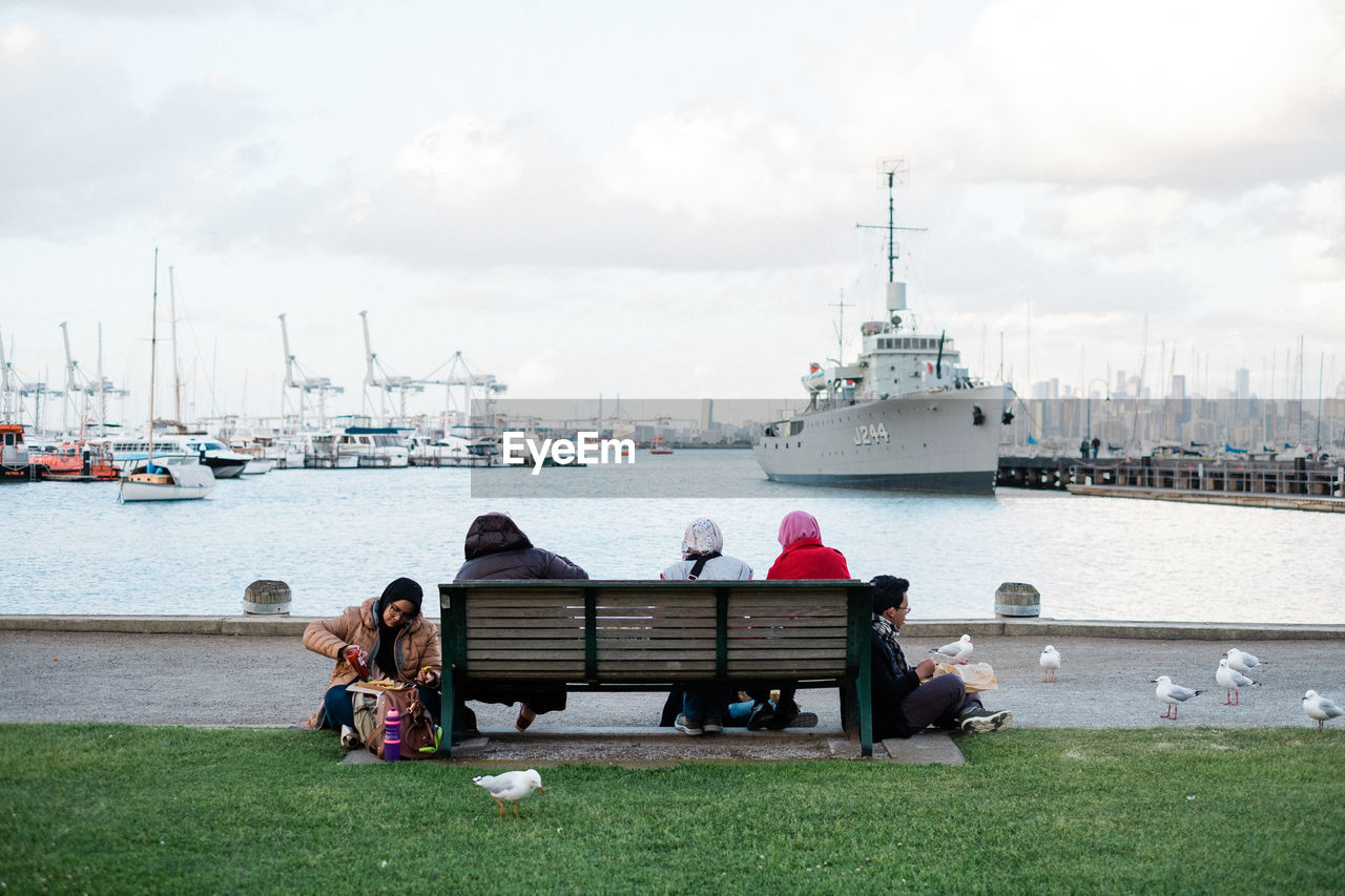 PEOPLE RELAXING ON BOAT