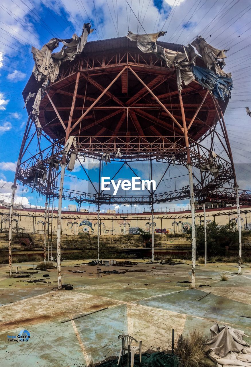 Low angle view of abandoned building against sky