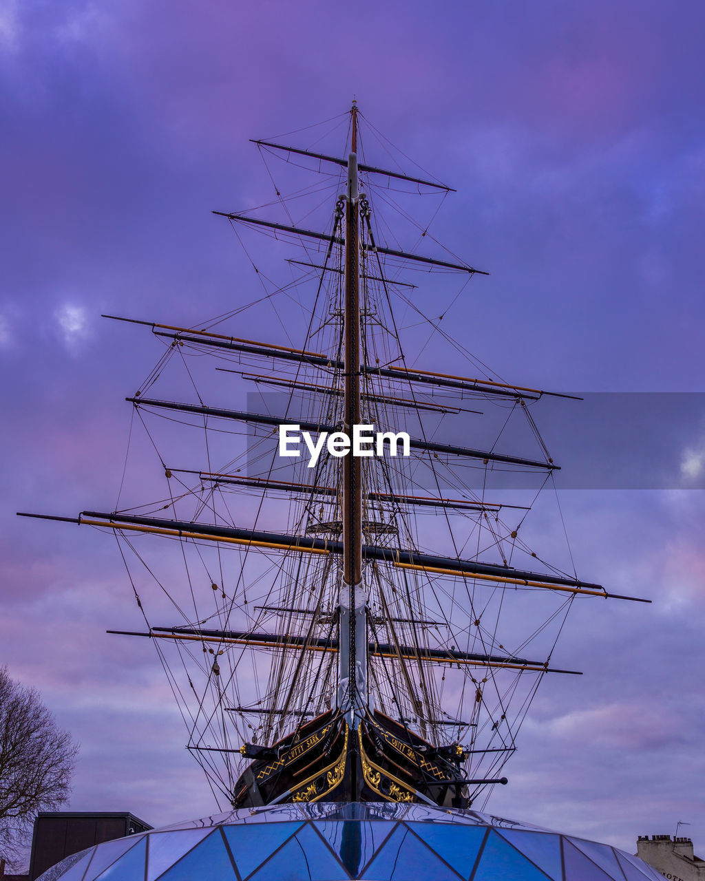 LOW ANGLE VIEW OF SAILBOAT AGAINST SKY DURING DUSK