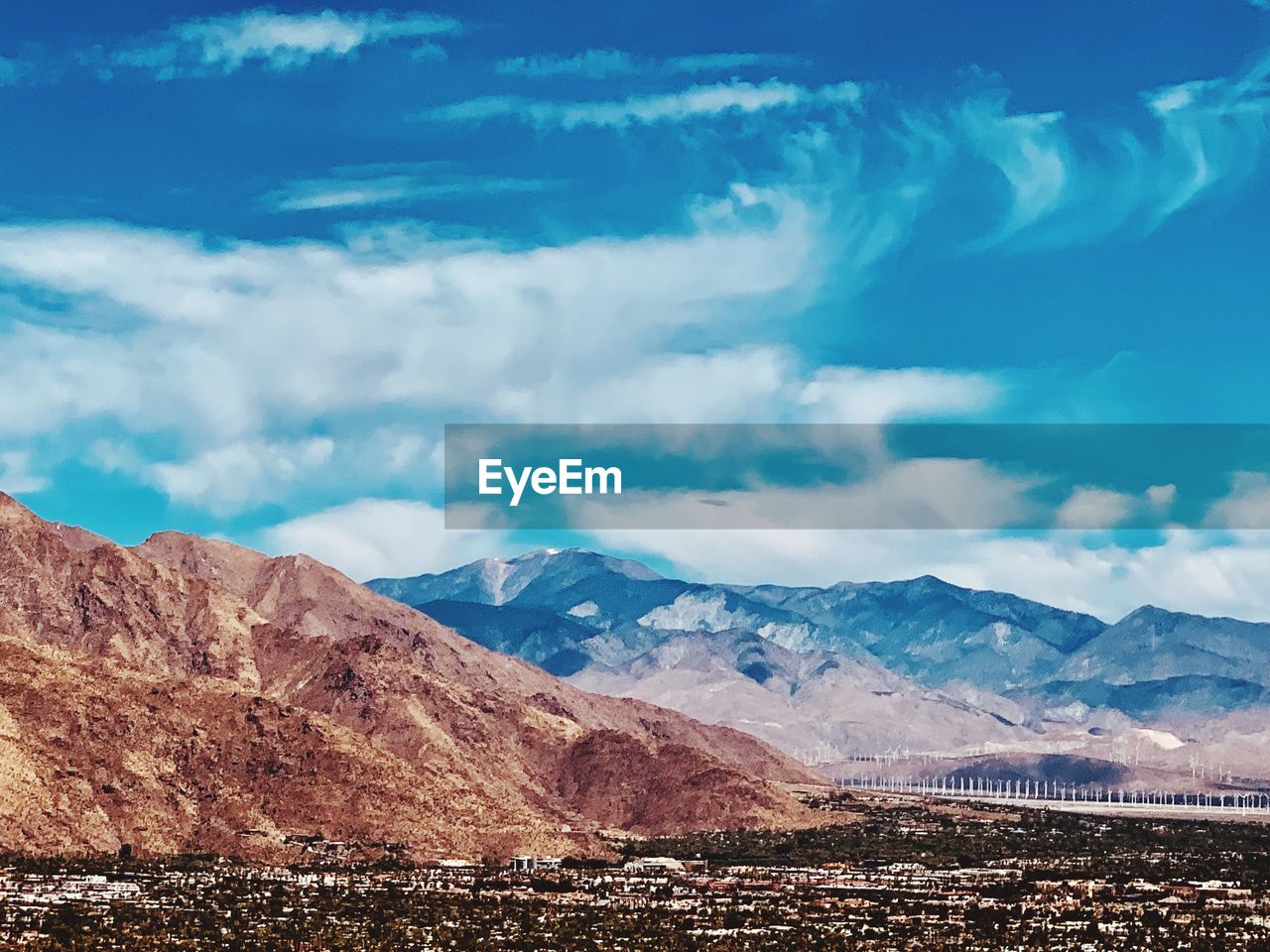 Scenic view of landscape against cloudy sky