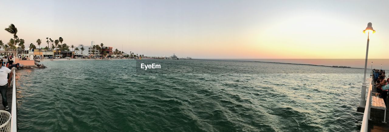 PANORAMIC SHOT OF SEA AGAINST CLEAR SKY