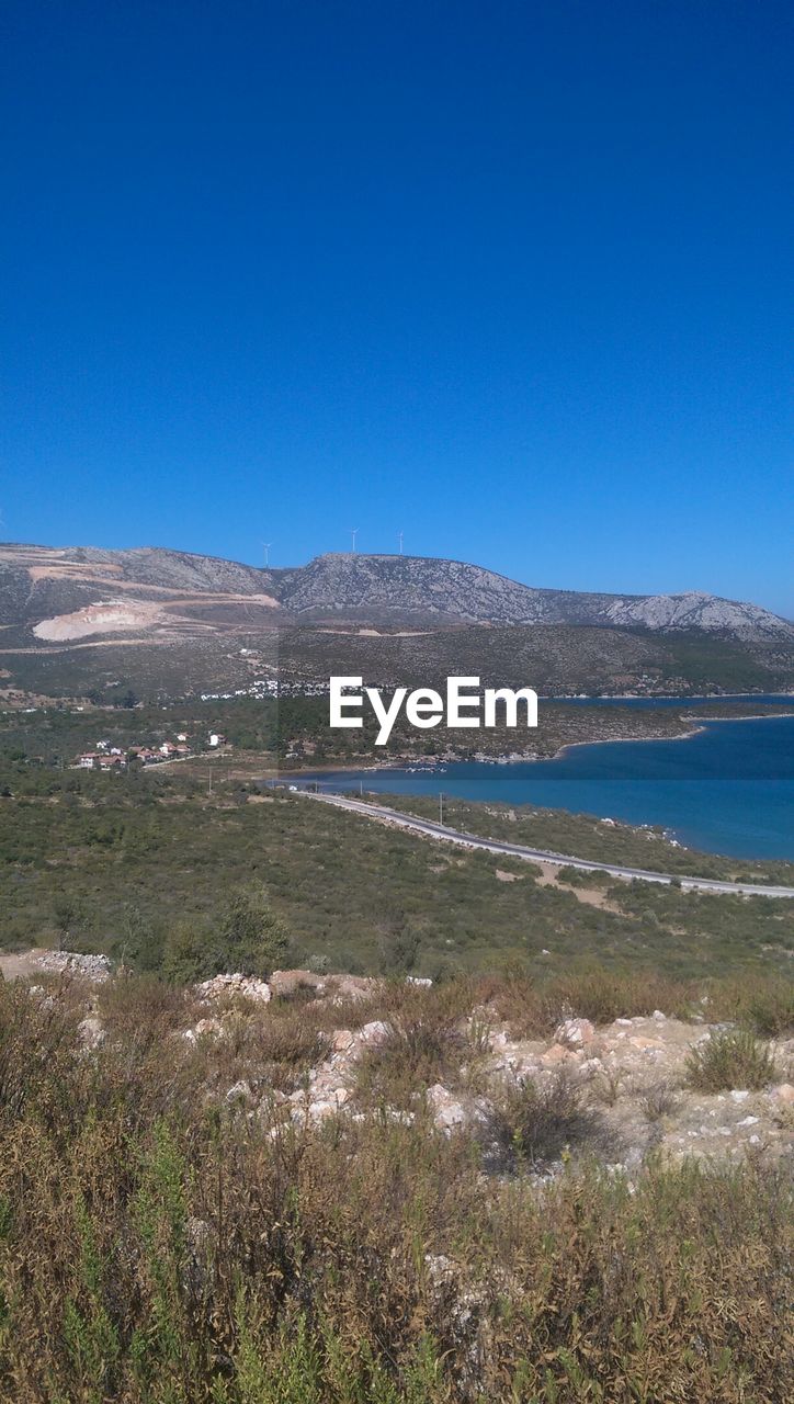 SCENIC VIEW OF MOUNTAINS AGAINST CLEAR BLUE SKY