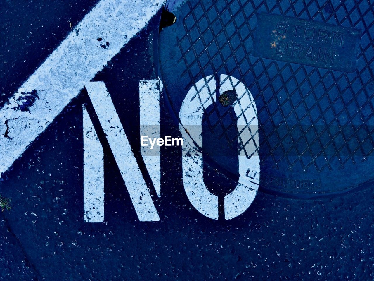 blue, sign, communication, road, font, guidance, transportation, symbol, no people, road sign, number, street, city, close-up, day, road marking, warning sign, information sign, marking, high angle view, text, white, western script, outdoors, circle