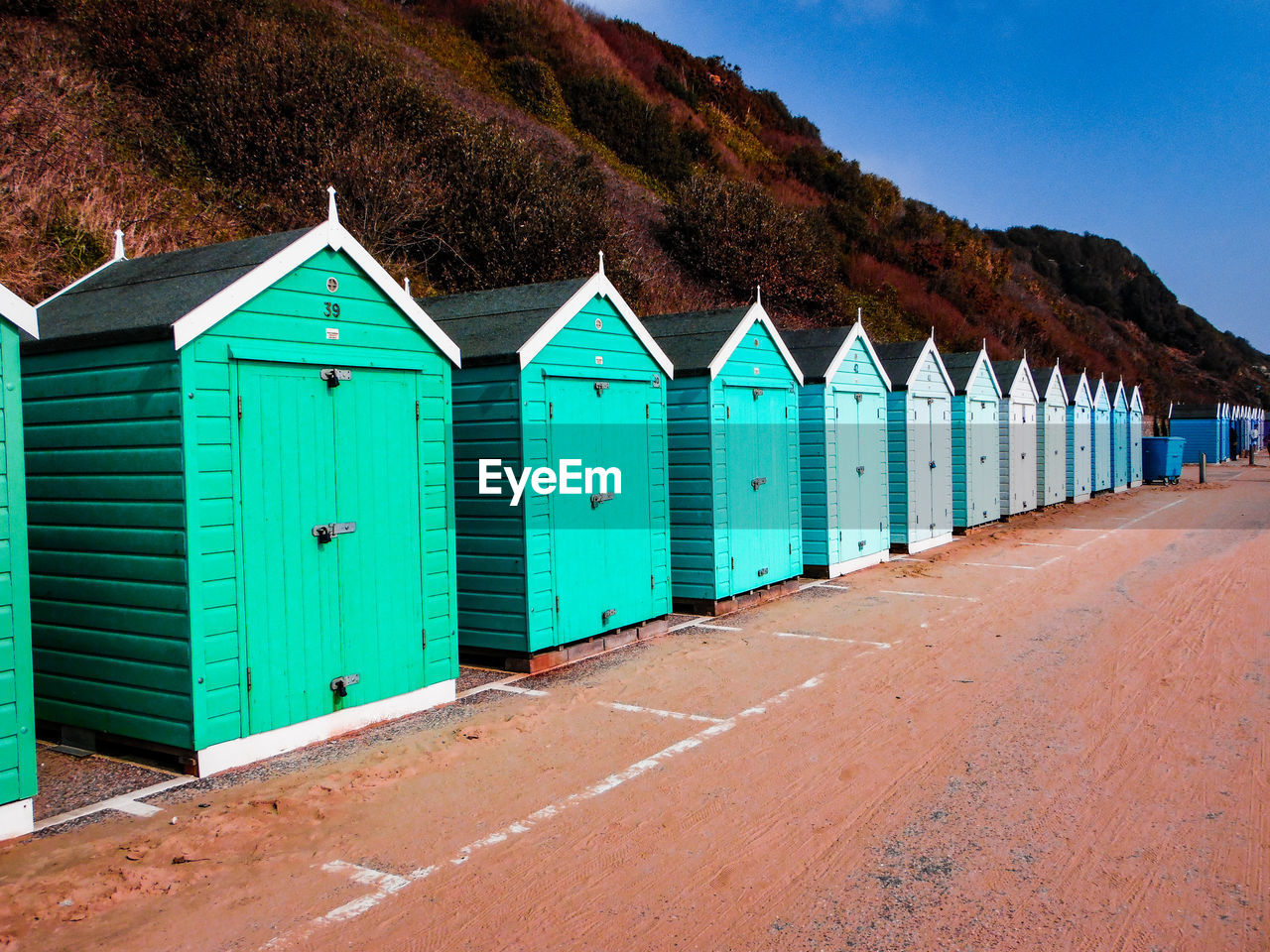 BEACH HUTS AGAINST SKY