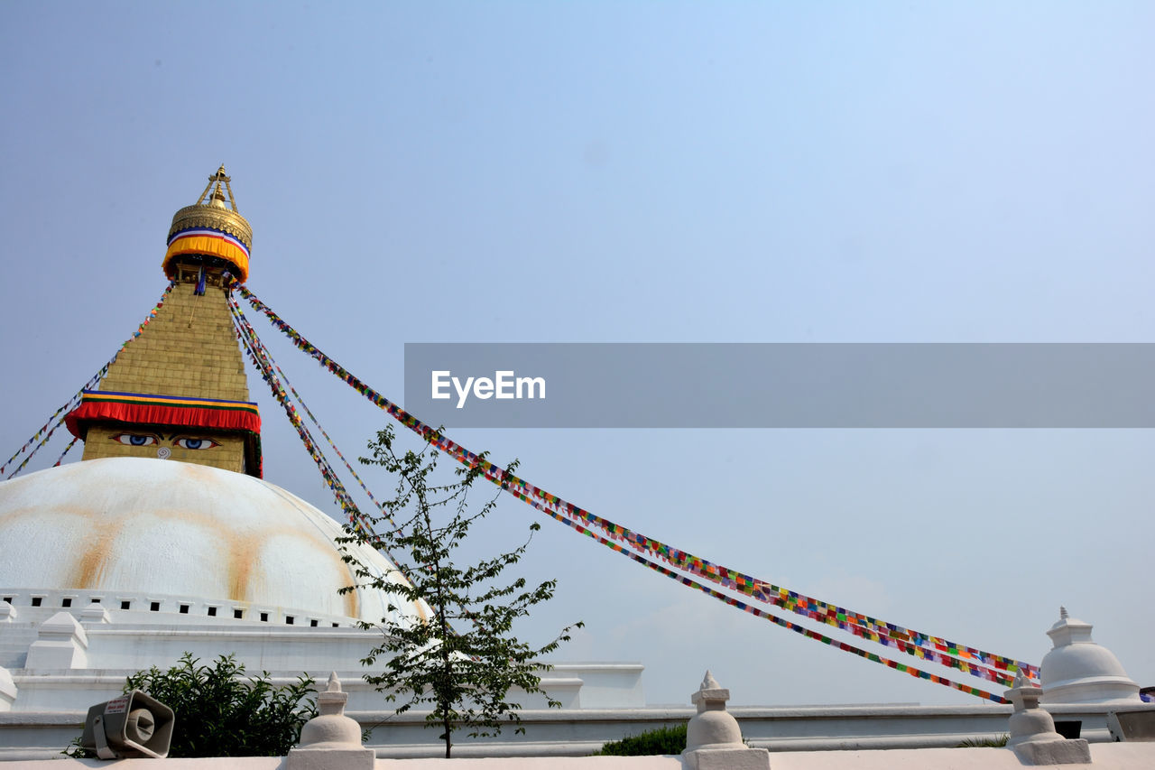 Low angle view of boudhanath stupa against sky