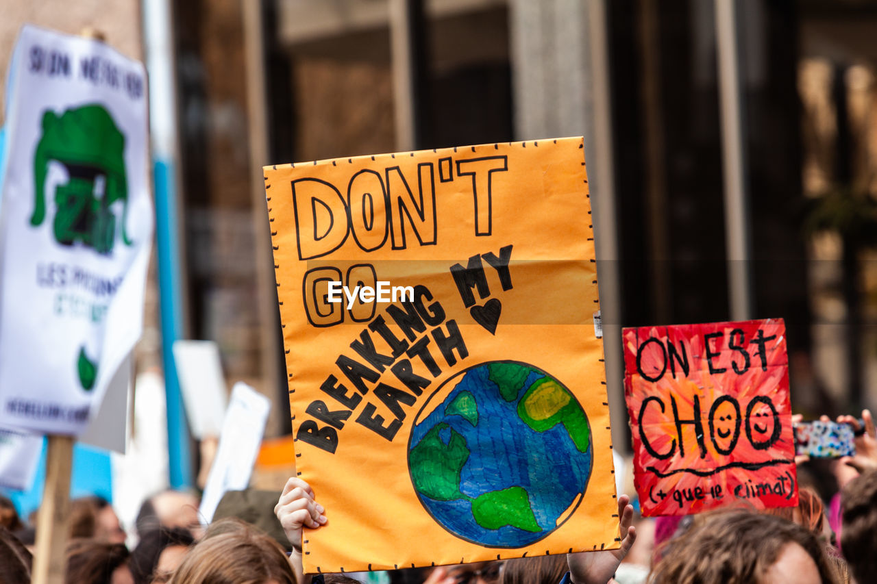 People protesting on street against city