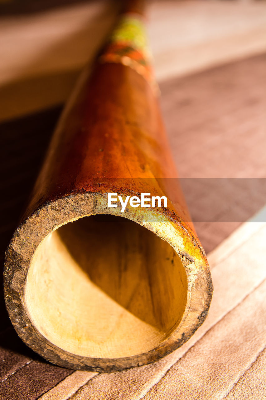 High angle view of wooden pipe on table