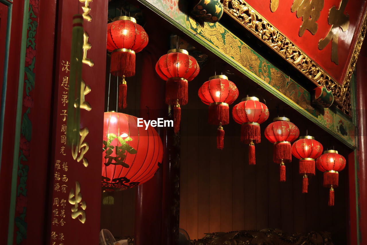 RED LANTERNS HANGING IN BUILDING