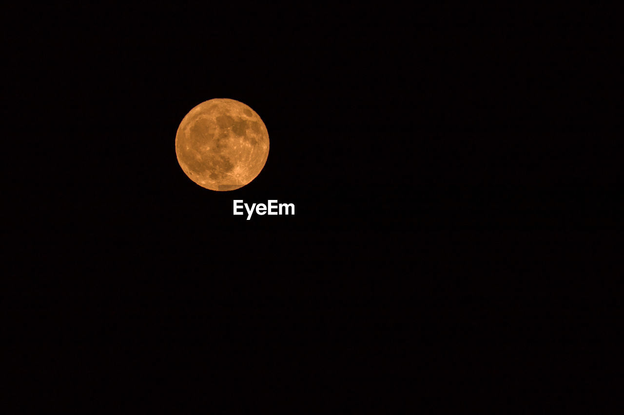 LOW ANGLE VIEW OF FULL MOON AGAINST SKY