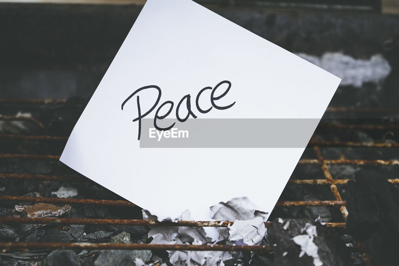 text, communication, no people, font, western script, white, art, handwriting, paper, close-up, indoors