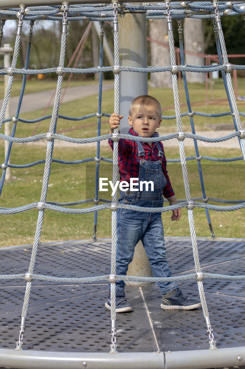 Cute boy playing at playground