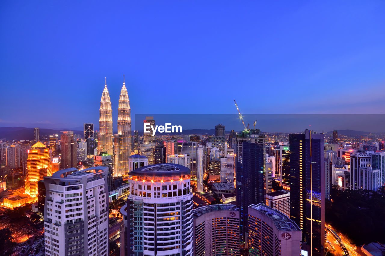 Illuminated buildings in city at night