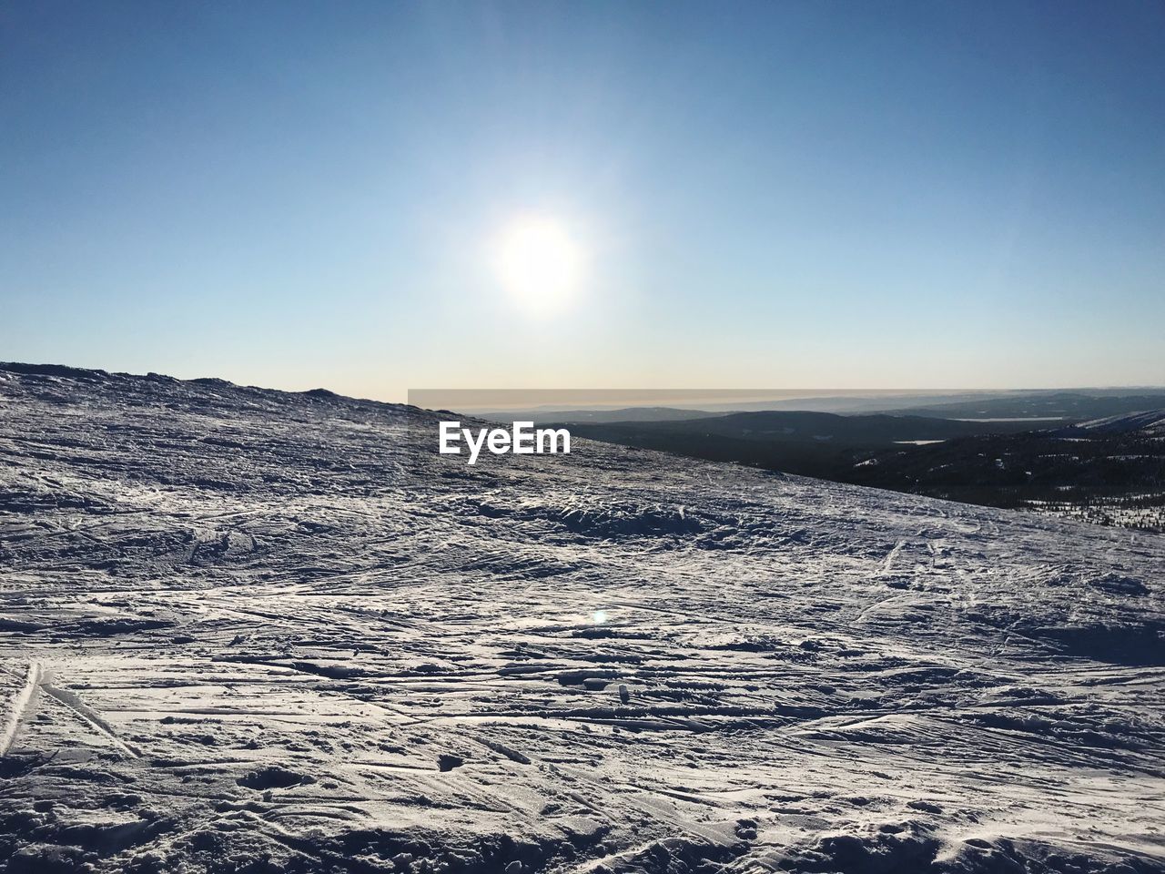 SCENIC VIEW OF DRAMATIC LANDSCAPE AGAINST SKY DURING WINTER