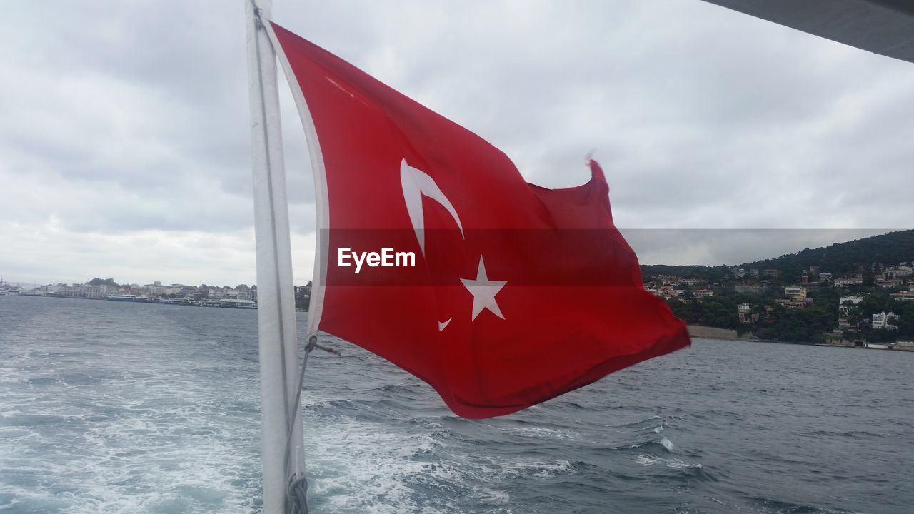 RED FLAG WAVING IN SEA