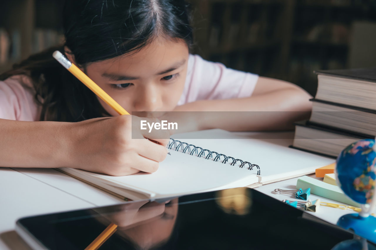 Girl studying at table