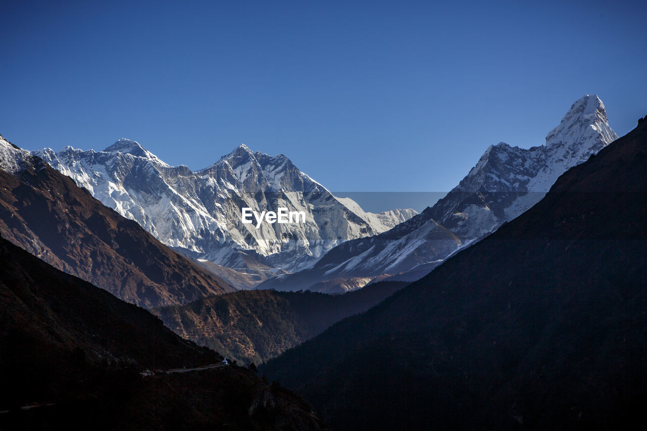 The himalayan peaks of everest (left), llotse (center) and ama dablam.
