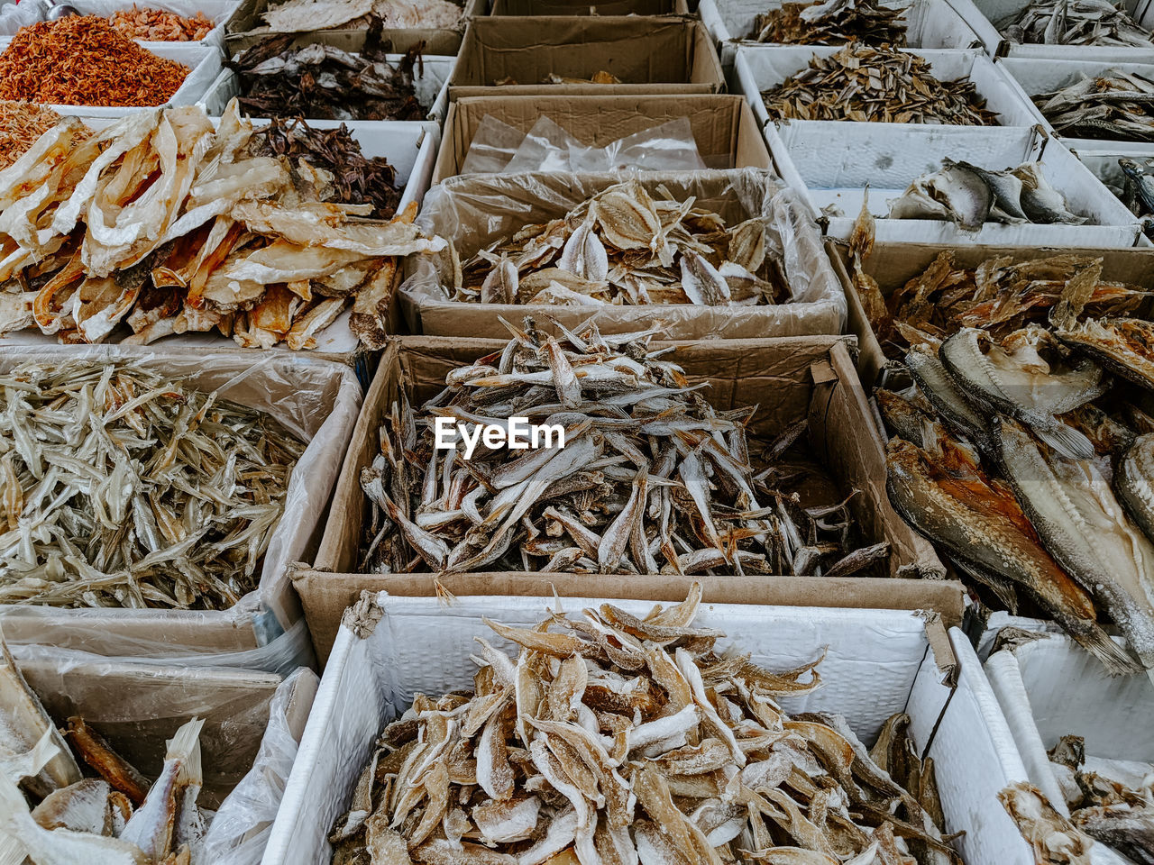 HIGH ANGLE VIEW OF DRY FISH FOR SALE AT MARKET