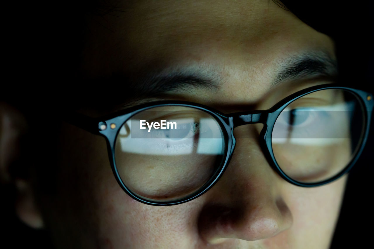 Close-up of man wearing eyeglasses