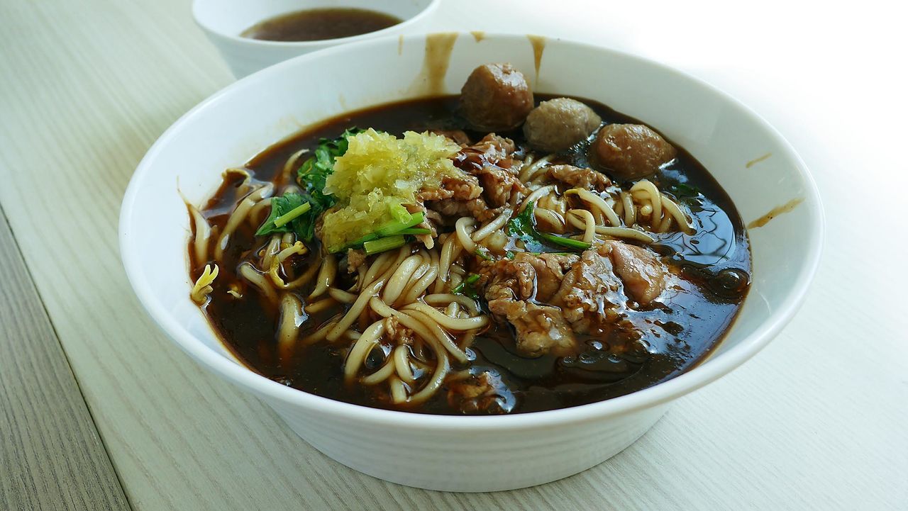 High angle view of beef noodles served in bowl on table