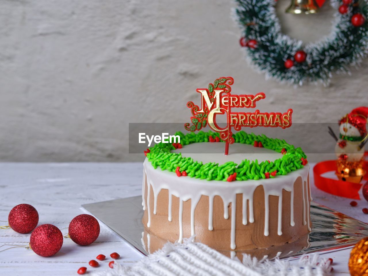 Close-up of cake with christmas decorations on table