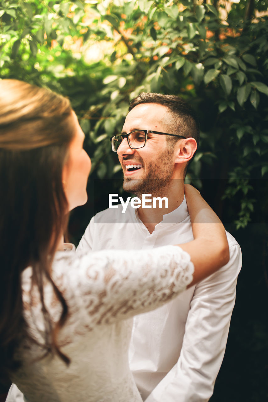 Close-up of couple embracing while standing outdoors