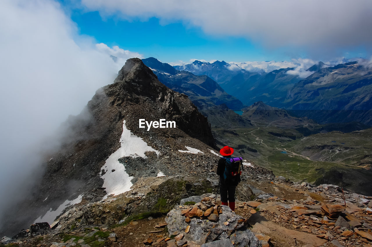 Rear view of man standing on mountains