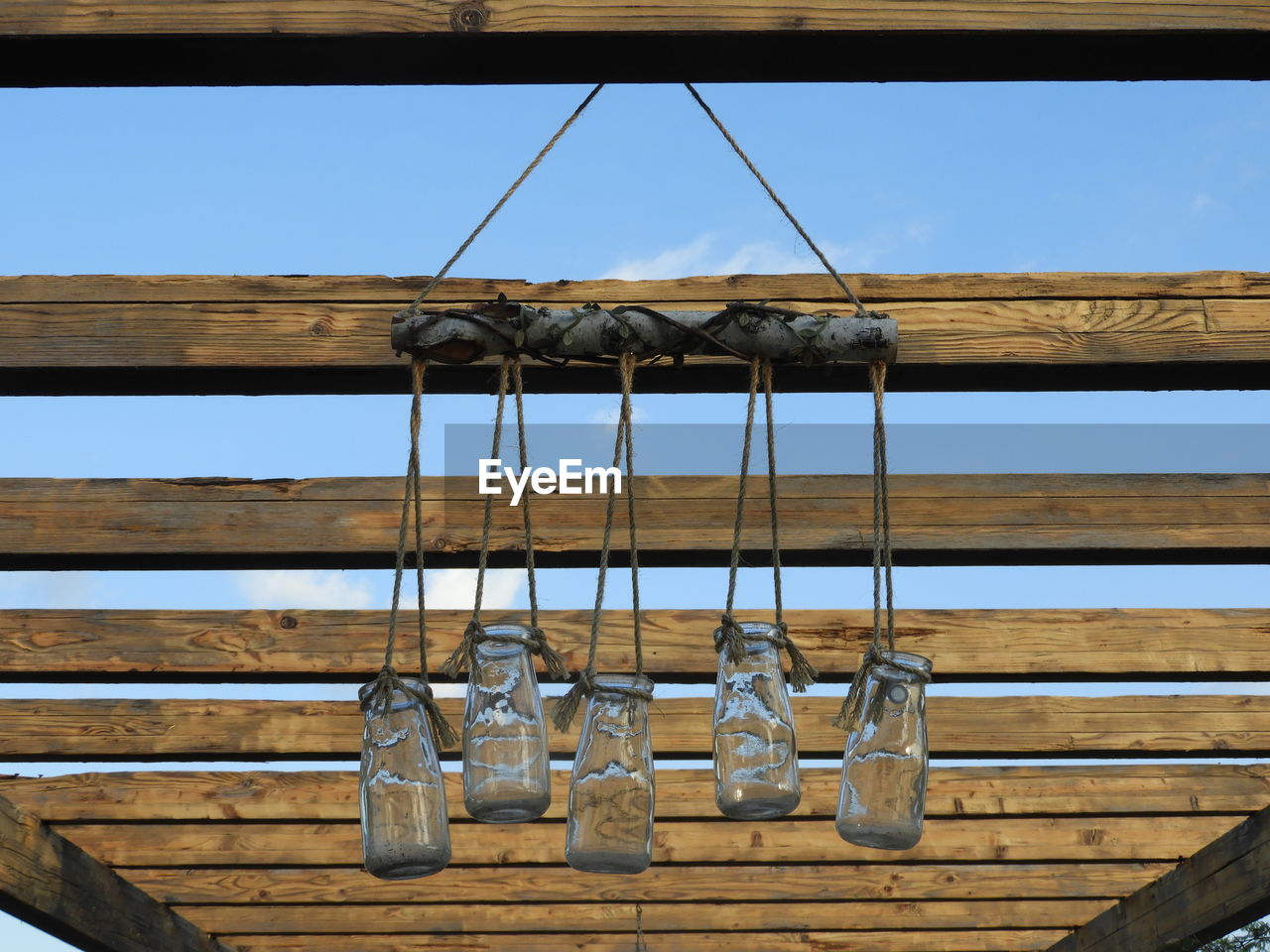 LOW ANGLE VIEW OF CLOTHES HANGING AGAINST CEILING