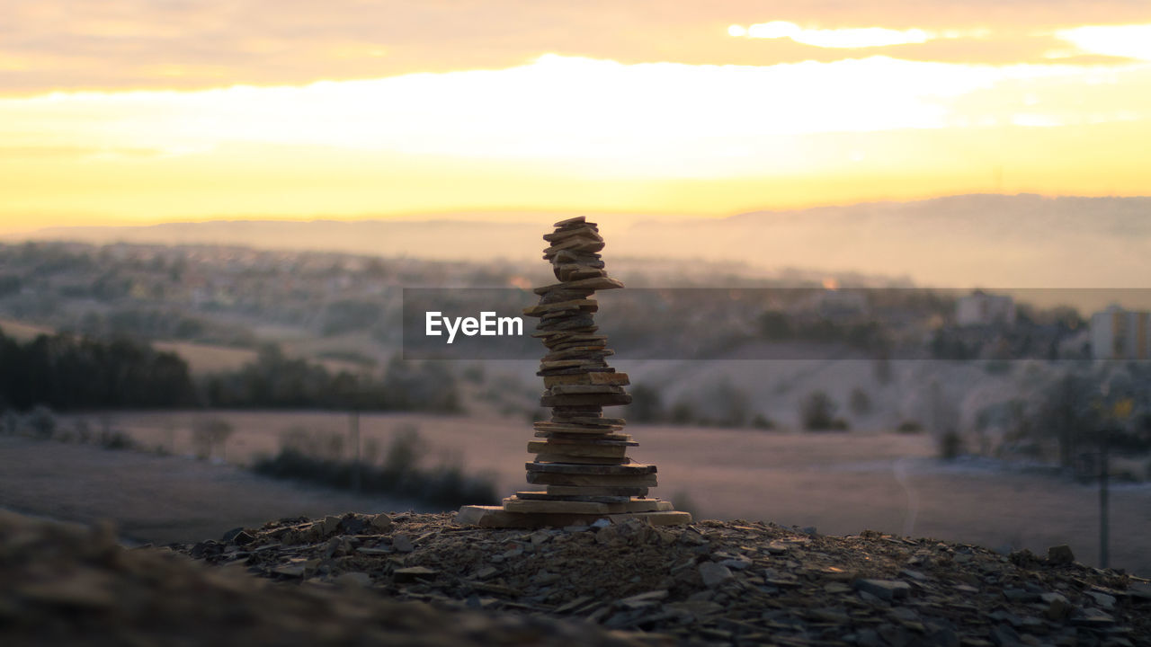 CLOSE-UP OF STACK OF ROCKS AGAINST SKY