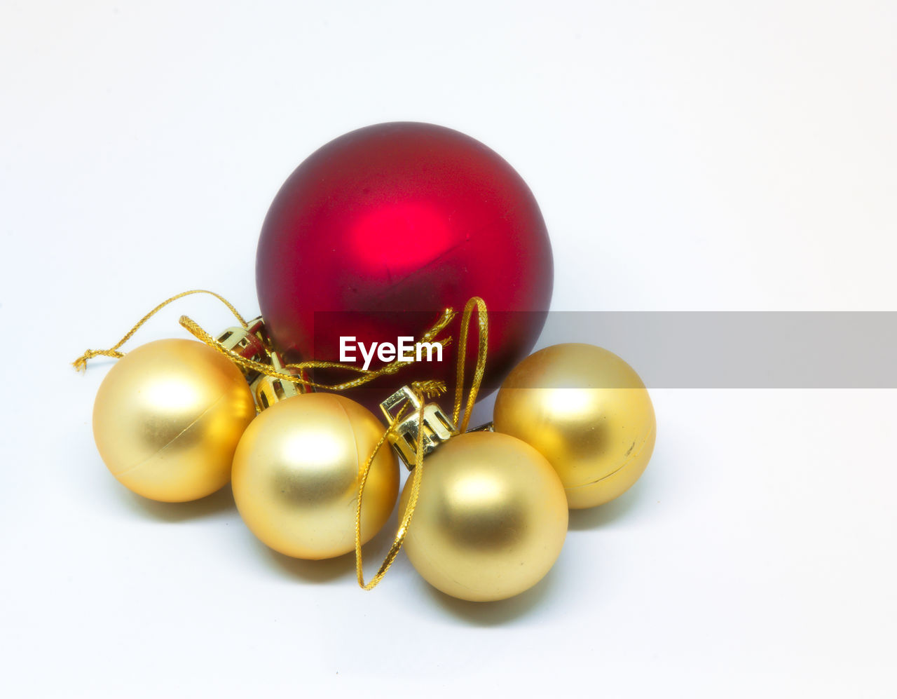 High angle view of christmas balls against white background