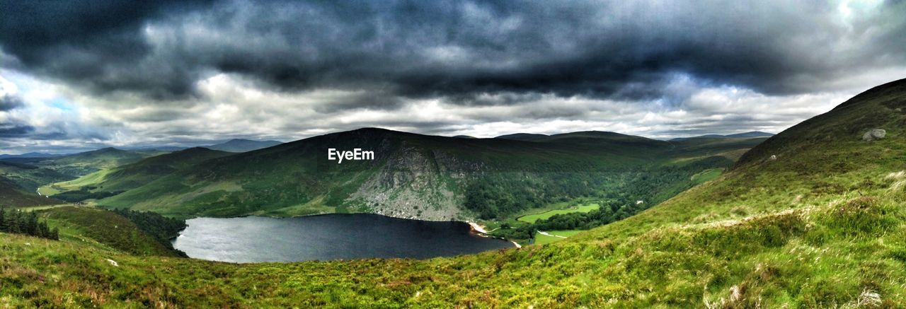 SCENIC VIEW OF GREEN LANDSCAPE AGAINST SKY