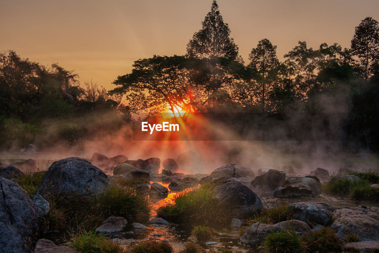 Morning fog over hot spring at chae sorn national park, thailand