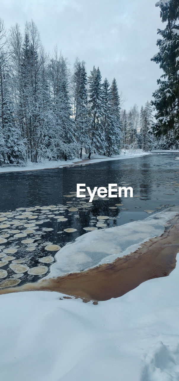 FROZEN LAKE AGAINST SKY