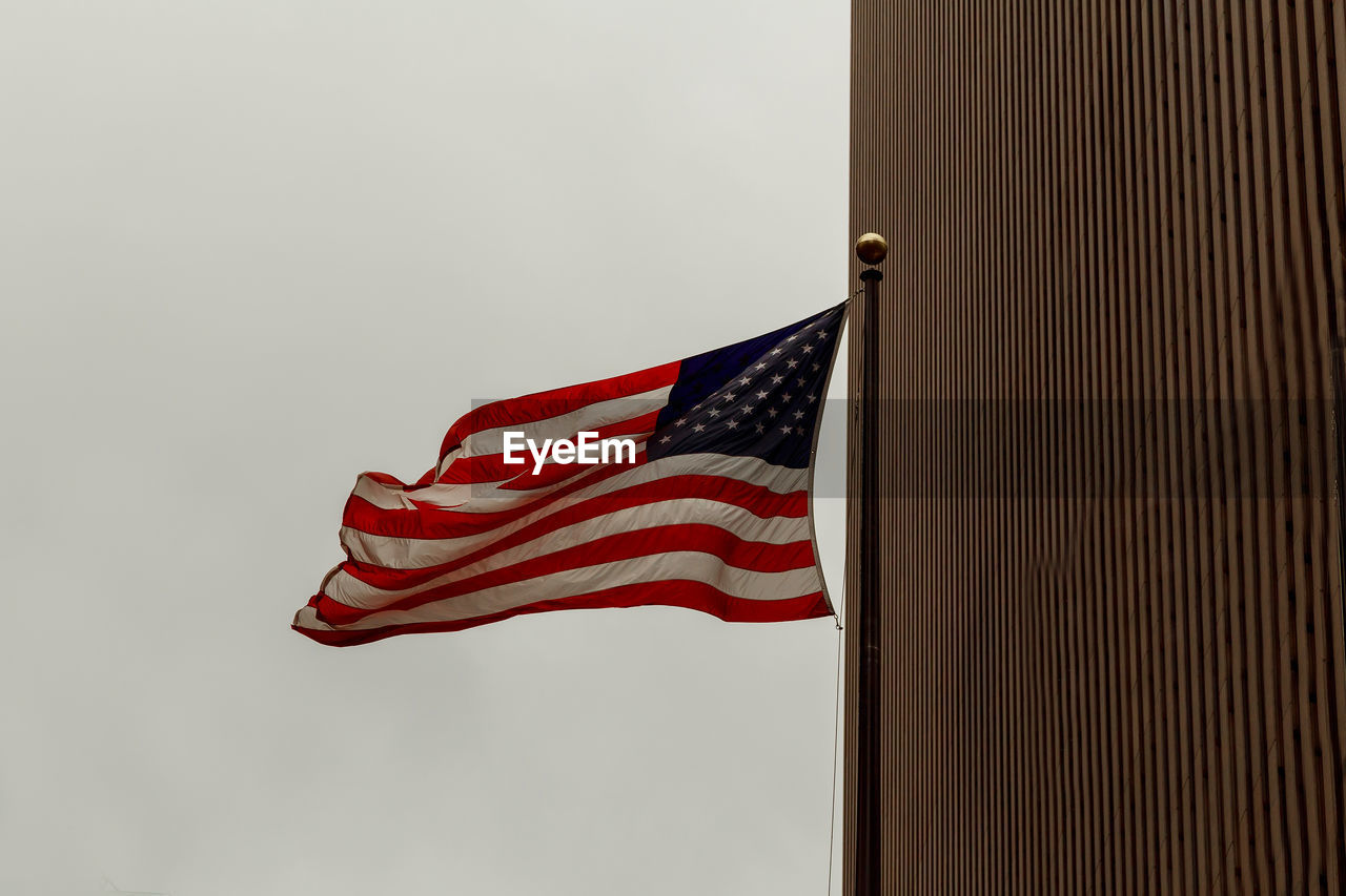 Low angle view of flag against sky