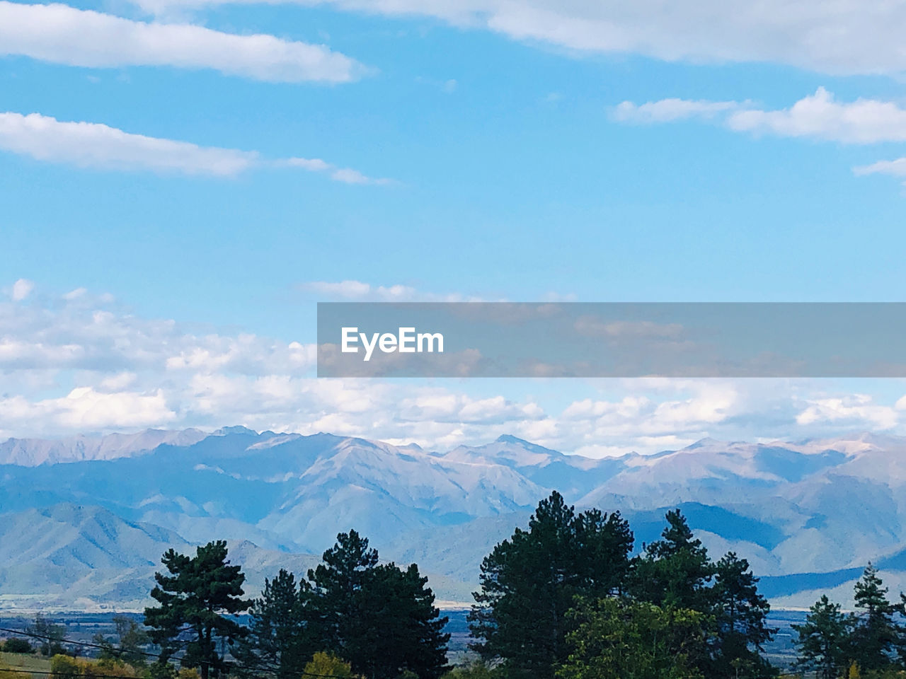 SCENIC VIEW OF MOUNTAINS AGAINST SKY DURING WINTER