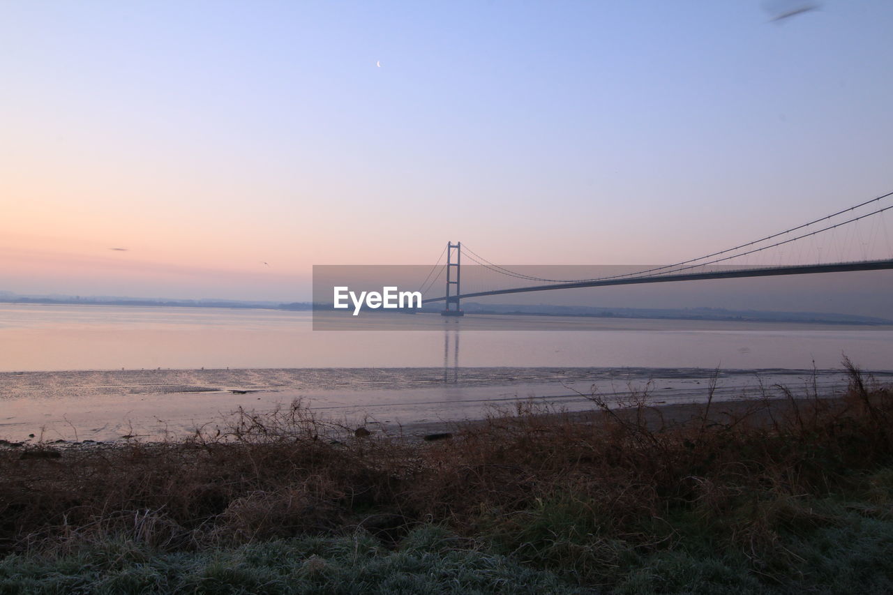 Scenic view of sea against clear sky during sunset