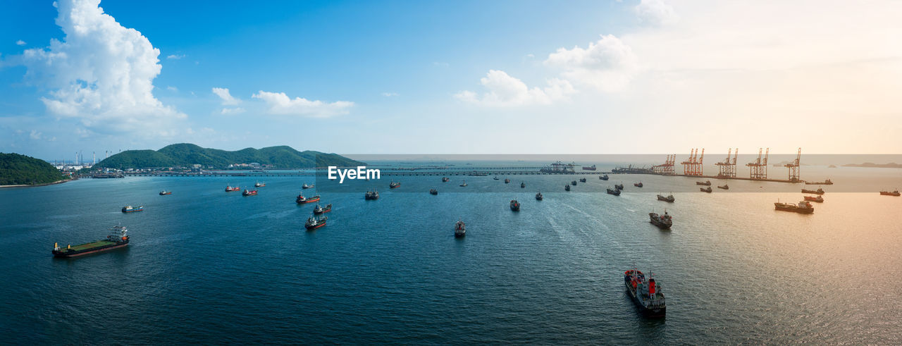 high angle view of people in boat in sea against sky