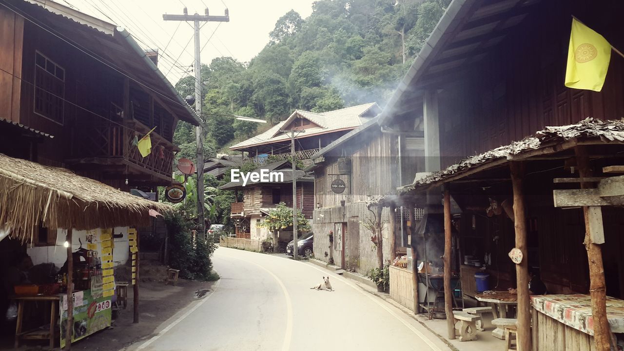 PANORAMIC SHOT OF HOUSES AGAINST SKY