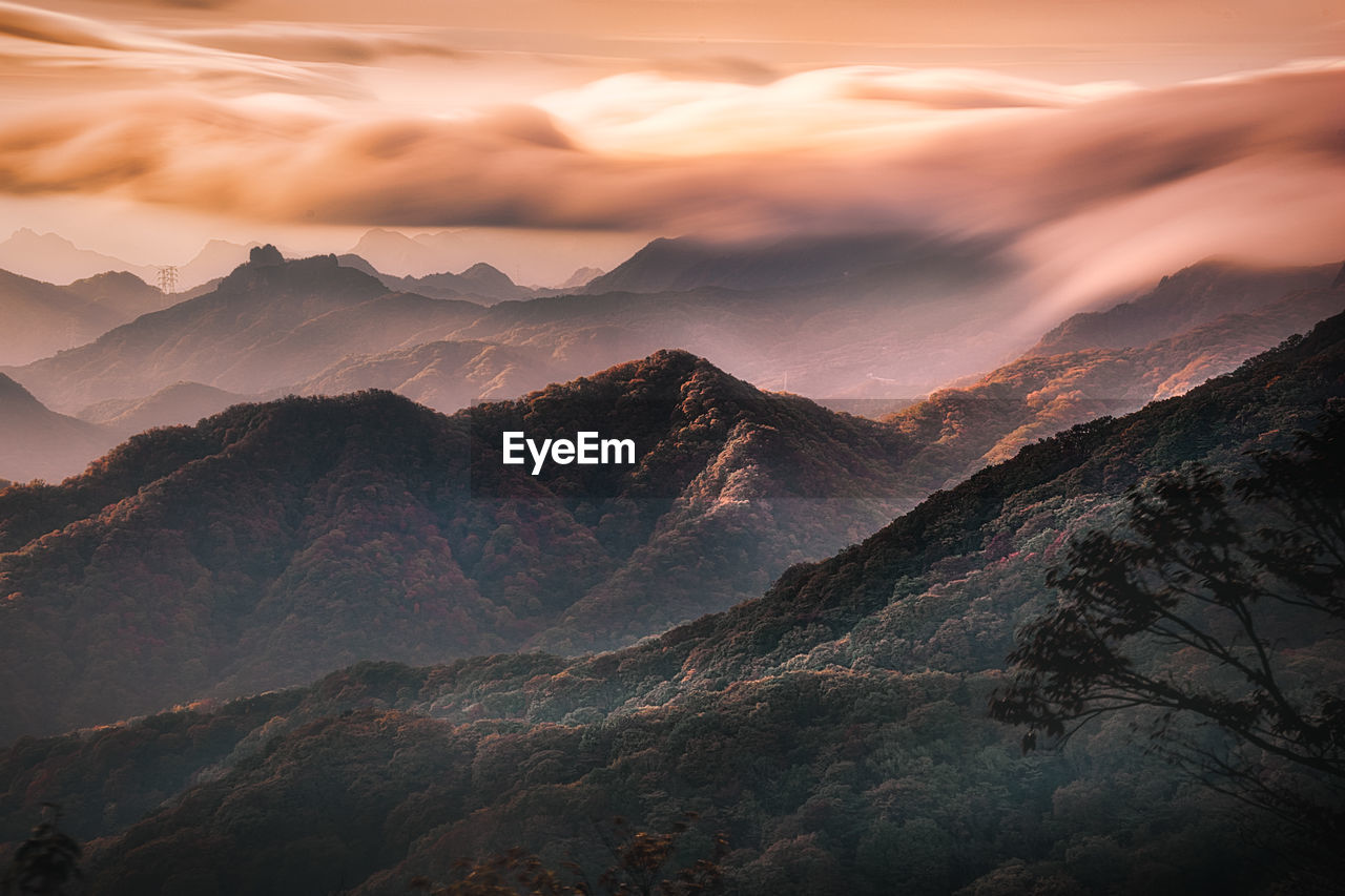 Scenic view of mountains against sky during sunset