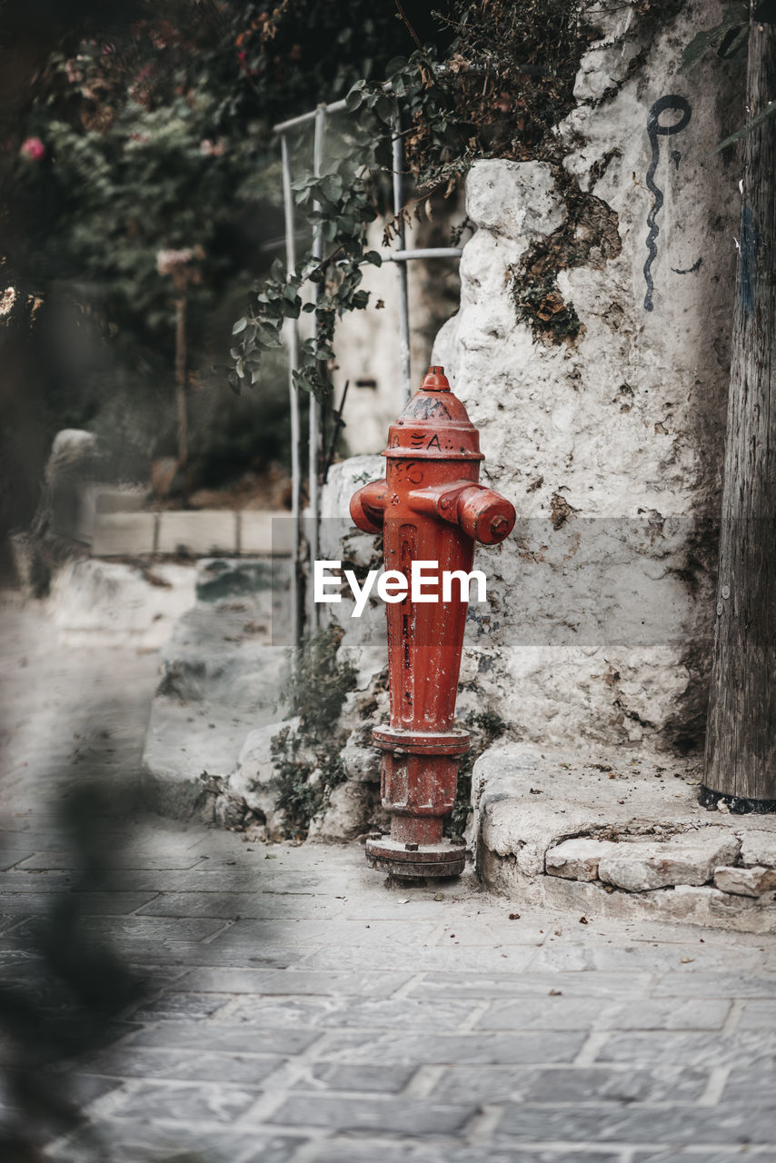 RED FIRE HYDRANT ON SIDEWALK
