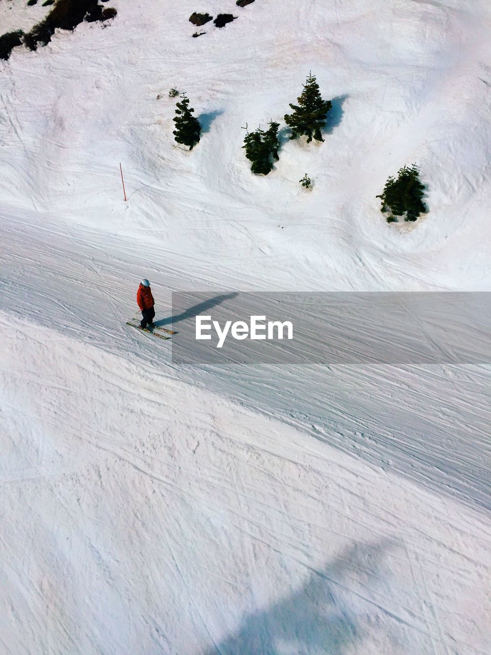 High angle view of person skiing on snow covered mountain