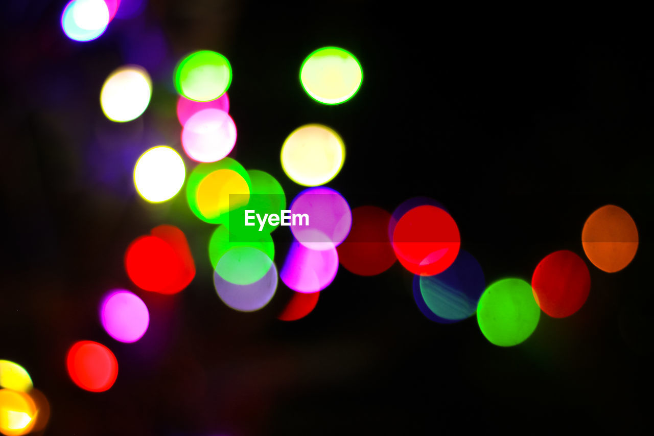 Defocused image of illuminated colorful lights