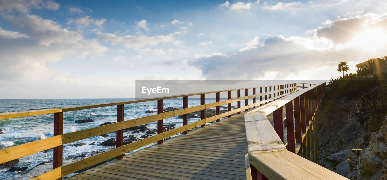 Wooden walkway in calahonda beach, mijas, malaga, spain