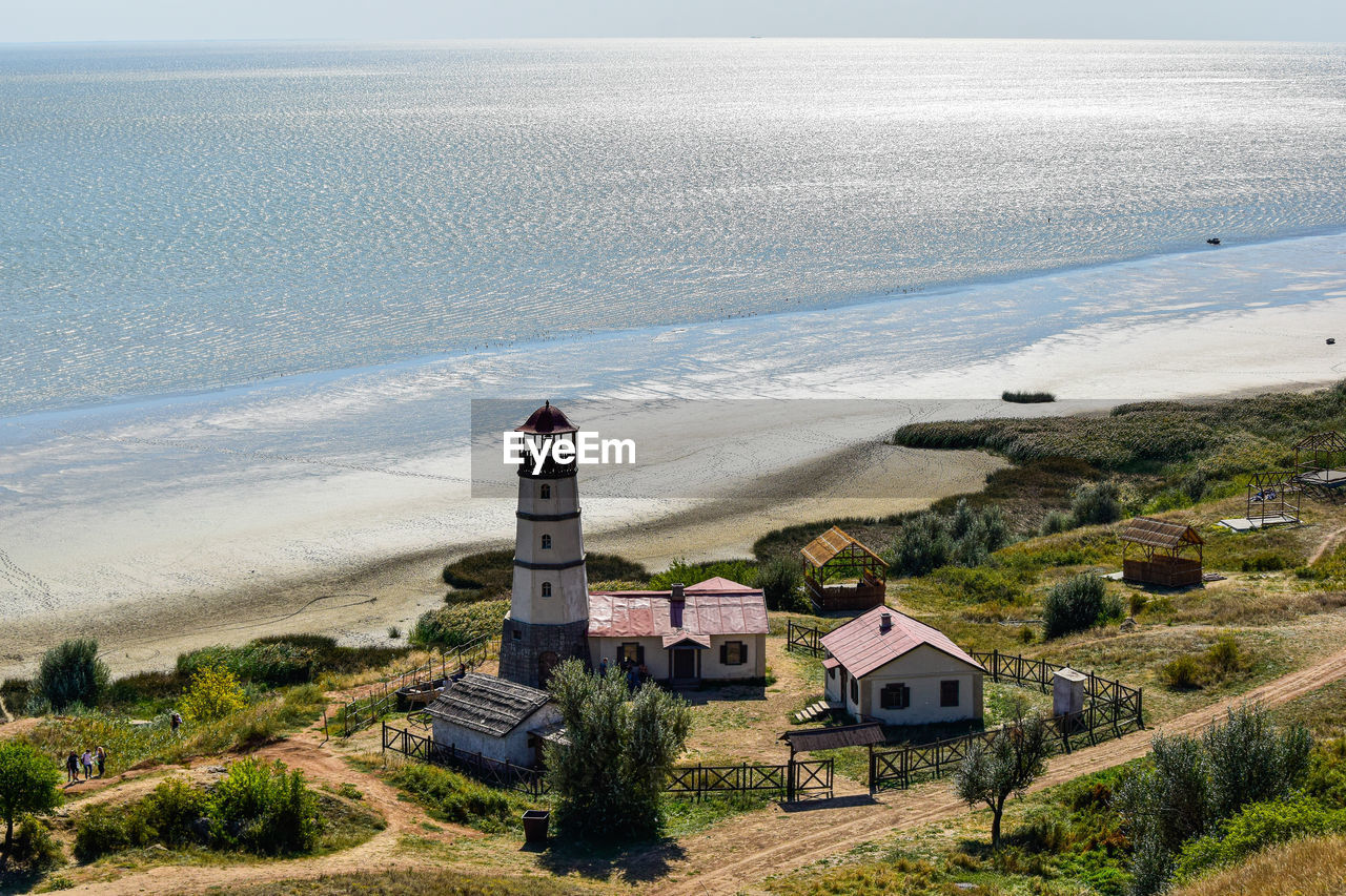 High angle view of buildings by sea