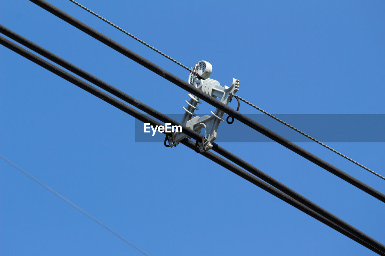 LOW ANGLE VIEW OF ELECTRIC LIGHT AGAINST CLEAR BLUE SKY