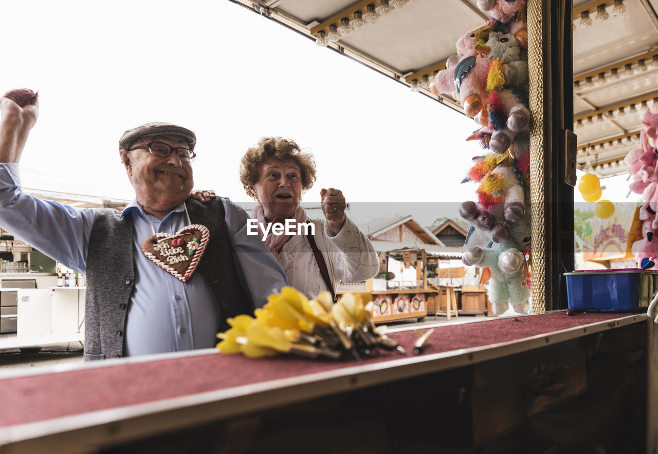 Senior couple having fun on fair