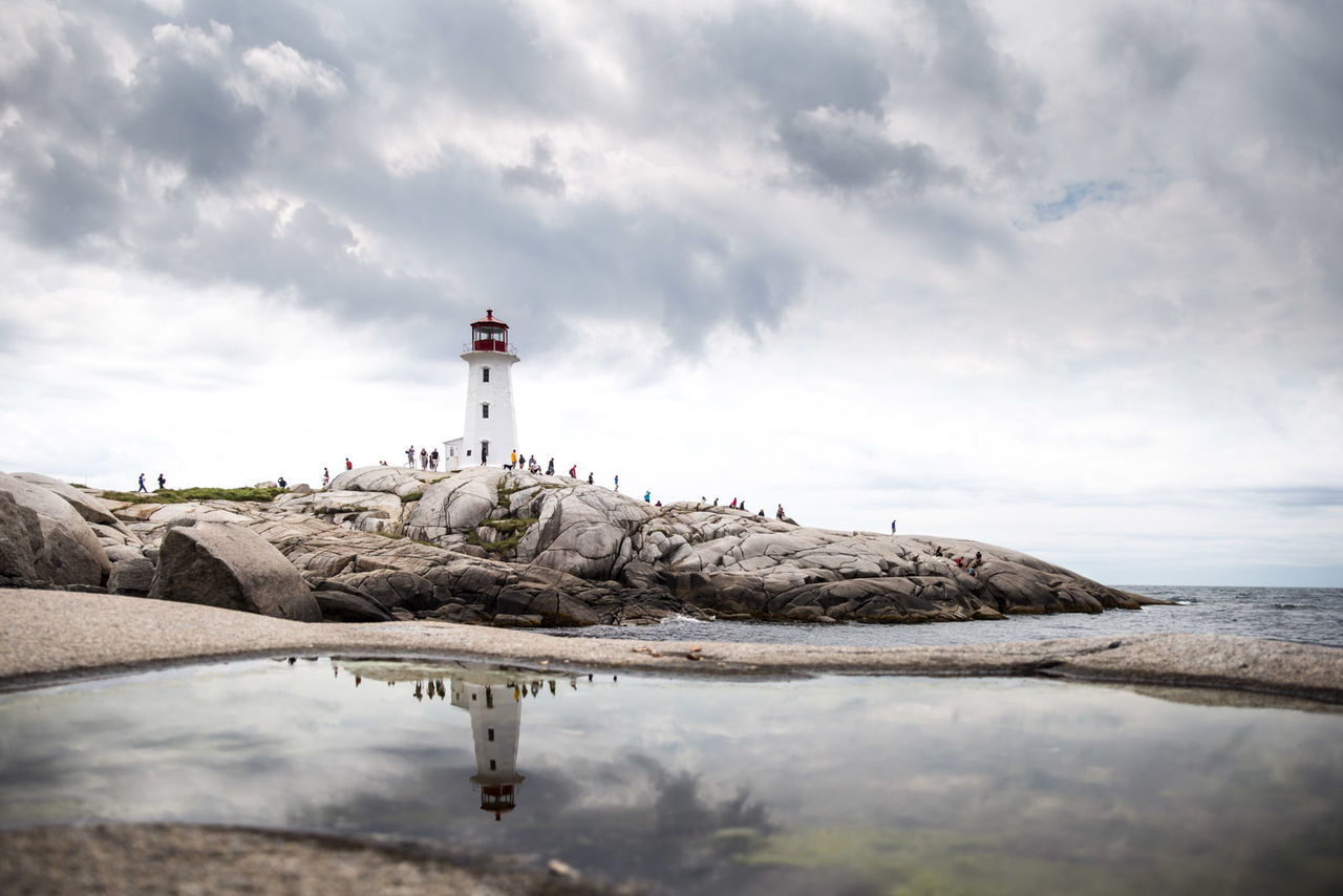 View of lighthouse against cloudy sky