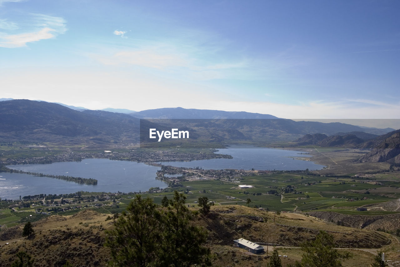 High angle view of landscape and sea against sky