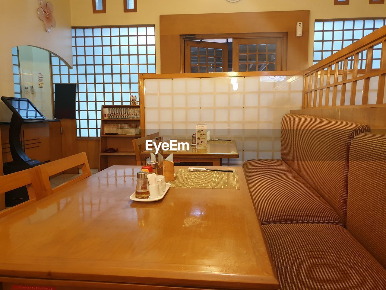 EMPTY CHAIRS AND TABLES IN RESTAURANT